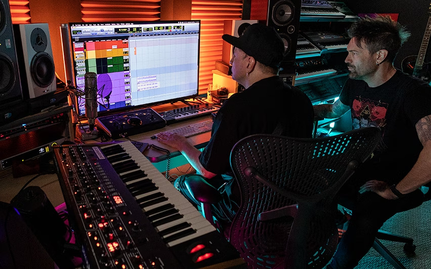 Image showing two music creators working with Avid Artist software